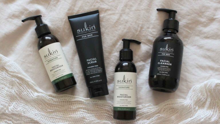 Bottles of Sukin cream on linen fabric